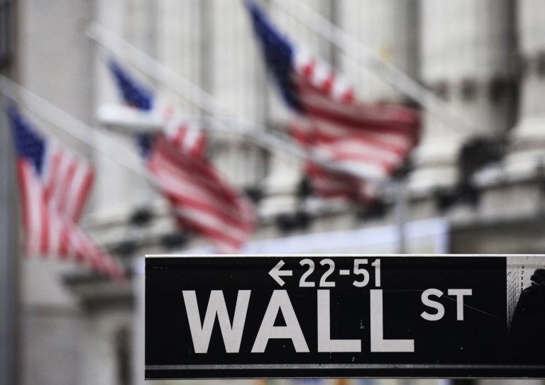 FILE - This file photo made April 22, 2010 shows a Wall Street sign in front of the New York Stock Exchange. U.S. stock futures rose on Wednesday, May 21, 2014, as investors await the minutes from the Federal Reserve's most recent meeting in April. (AP Photo/Mark Lennihan, File)