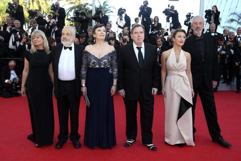 From second left, director Mike Leigh, actress Marion Bailey, actor Timothy Spall, actress Dorothy Atkinson and director of photography Dick Pope pose for photographers as they arrive for the screening of Mr. Turner at the 67th international film festival, Cannes, southern France, Thursday, May 15, 2014. (AP Photo/Alastair Grant)