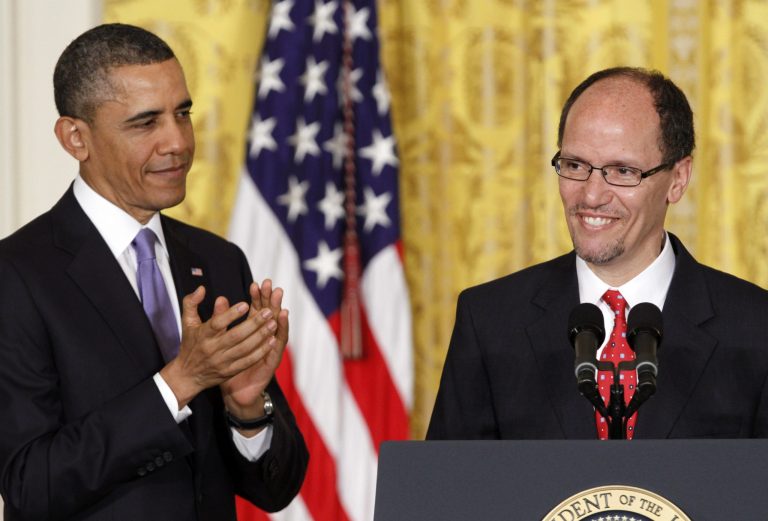 President Obama stands with Labor Secretary Thomas E. Perez. (AP/Jacquelyn Martin)