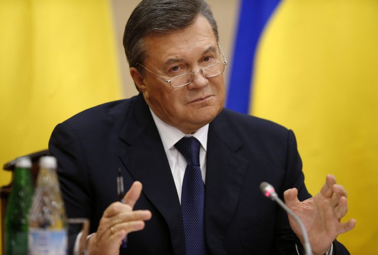 Ukraine's fugitive president Viktor Yanukovych speaks at a news conference in Rostov-on-Don, a city in southern Russia about 1,000 kilometers (600 miles) from Moscow, Friday, Feb. 28, 2014. Ukrainian fugitive president appears for first time since Saturday at Russia news conference. (AP Photo/Pavel Golovkin)