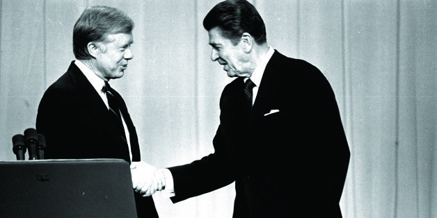 In this Oct. 28, 1980 file photo, President Jimmy Carter, left, and Republican presidential candidate Ronald Reagan, shake hands in Cleveland, Ohio, before debating before a nationwide television audience.