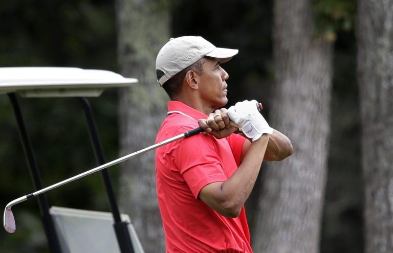 President Obama follows through on a swing while golfing at Farm Neck Golf Club in Oak Bluffs, Mass., on the island of Martha's Vineyard on Aug. 23. (AP Photo/Steven Senne)