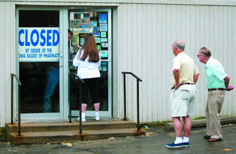 This Sept. 12, 2003 photo shows customers outside the Union Family Pharmacy in Dubuque, Iowa, after it was closed by federal agents that found evidence it had illegally dispensed drugs on the Internet. On Aug. 9, 2012, a federal judge in Iowa dropped a 2007 indictment against fugitive Miami doctor Armando Angulo, charged in a scheme to sell prescription drugs and launder money, in part because of the size of the case file. The Drug Enforcement Administration says the evidence starts with the Dubuque raid that eventually secured the conviction of 26 defendants, including 19 doctors, in federal court in Iowa. The investigation dismantled two Internet pharmacies that illegally sold 30 million pills to customers. (AP Photo/Telegraph Herald, Dave Kettering)
