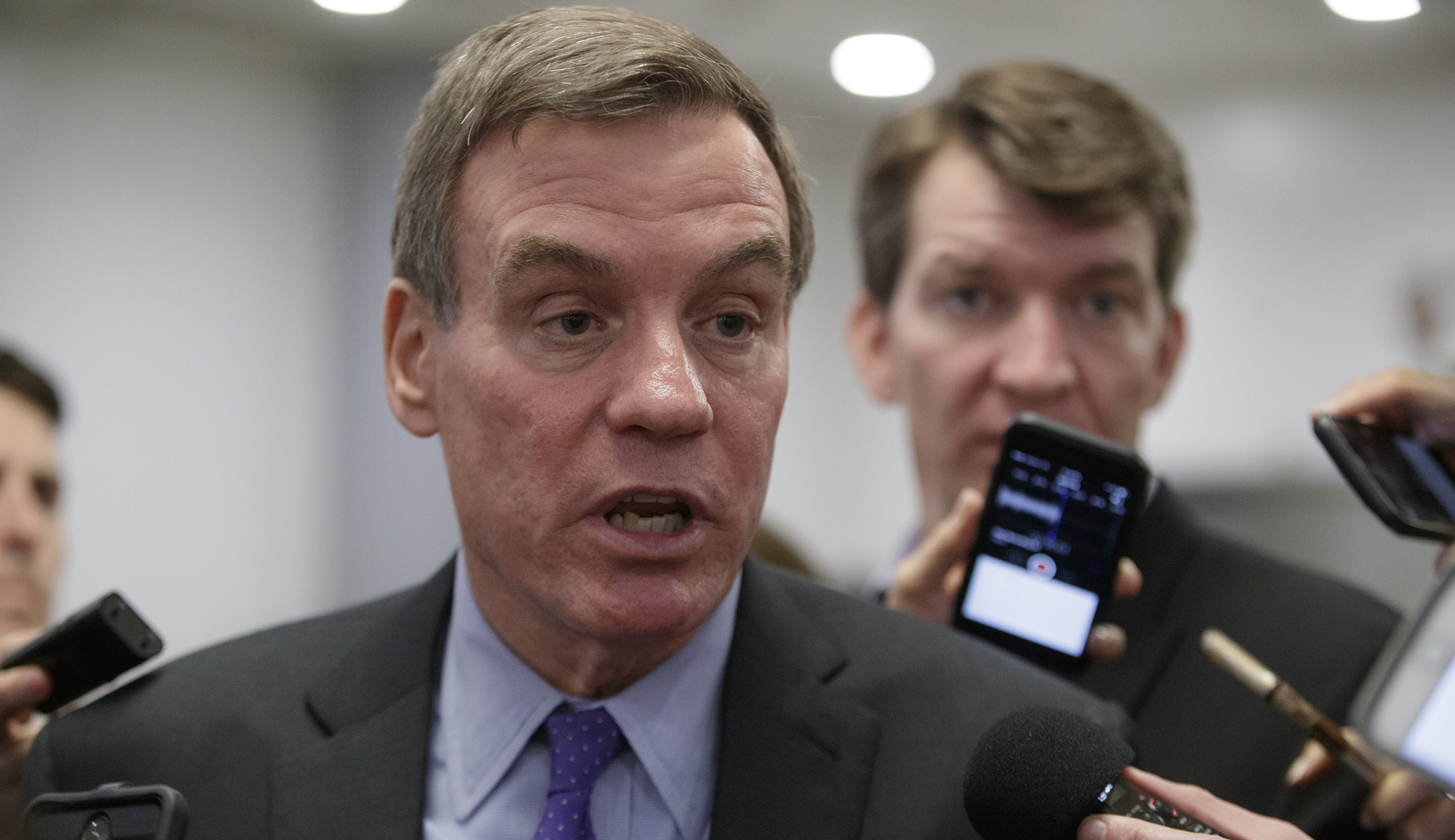 Mark Warner goes after Trump administration’s James Comey controversies in FISA hearing