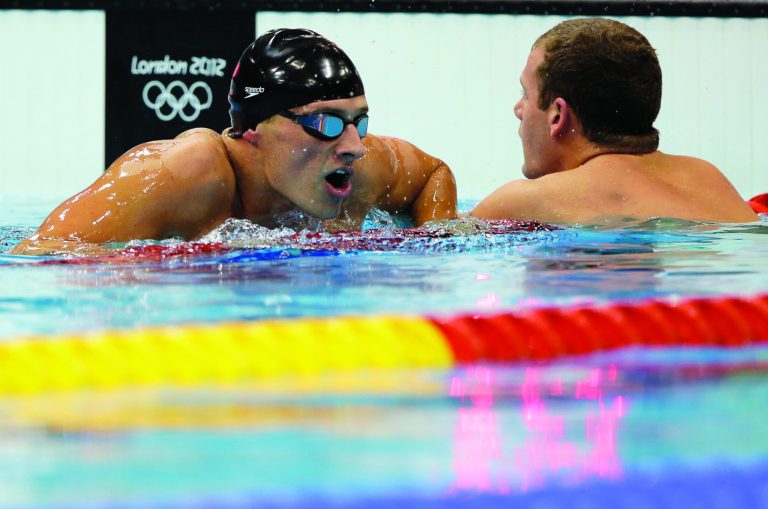 United States' Ryan Lochte, left, talks with teammate Tyler Clary, right, after competing in the men's 200-meter backstroke swimming final at the Aquatics Centre in the Olympic Park during the 2012 Summer Olympics in London, Thursday, Aug. 2, 2012. (AP Photo/Matt Slocum)