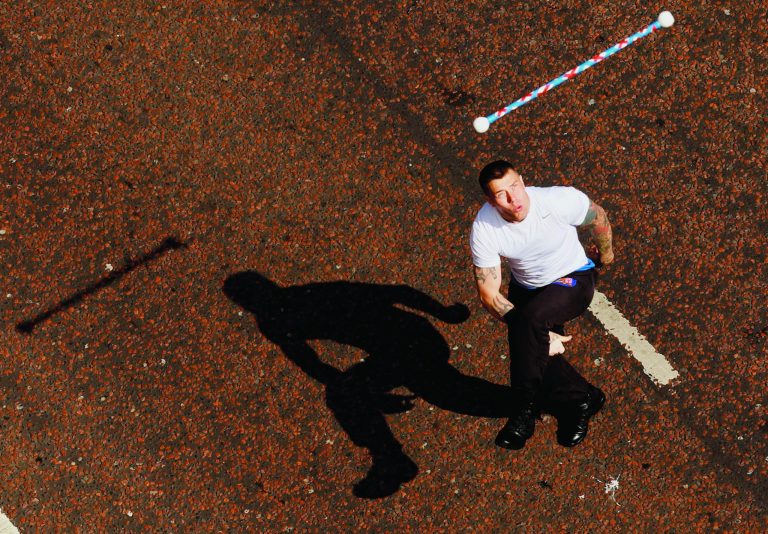 A Protestant bandsman joins the parade North Belfast, Northen Ireland, Thursday, July 12, 2012. The Twelfth of July is the busiest day of the marching season in Northern Ireland with thousands of Orangemen and women, accompanied by marching bands, taking part in hundreds of parades. The Orange Order holds its main Belfast event, which commemorates King William III's 1690 Battle of the Boyne victory over Catholic King James II. (AP Photo/Peter Morrison)