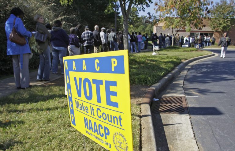 Voters stand in line to vote at an early voting site in Charlotte, N.C., Thursday, Oct. 23, 2008. 