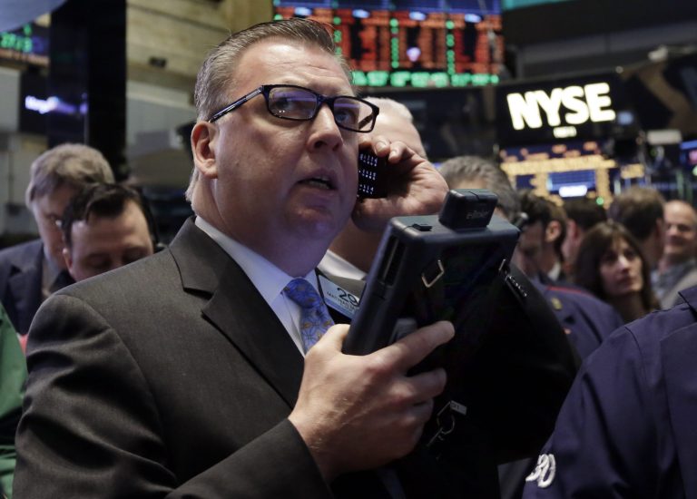 Trader Mathias Roberts works on the floor of the New York Stock Exchange, Wednesday, March 26, 2014. (AP Photo/Richard Drew)