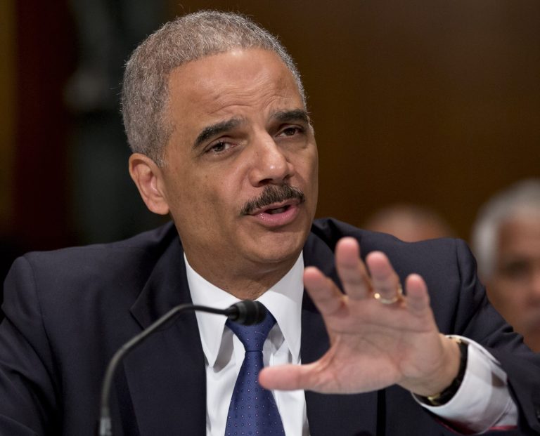 FILE - In this June 6, 2013, file photo, Attorney General Eric Holder testifies on Capitol Hill in Washington, Thursday, June 6, 2013.  The U.S. government's aggressive prosecution of leaks and efforts to control information are having a chilling effect on journalists and government whistle-blowers, according to a report released Thursday, Oct. 10, 2013, on U.S. press freedoms under the Obama administration. (AP Photo/J. Scott Applewhite, File)