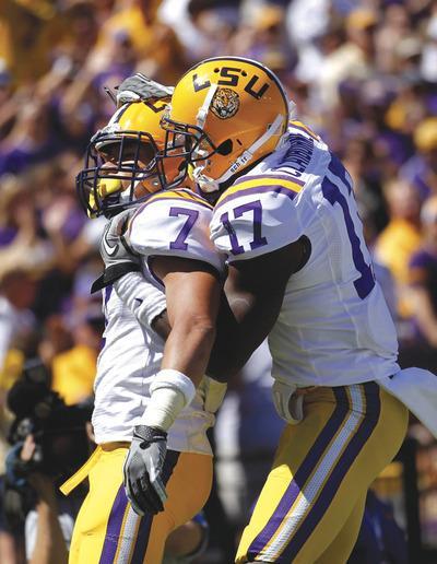 Gerald Herbert/AP
Tyrann Mathieu(7)and Morris Claiborne