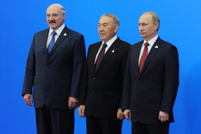 From left: Belarus President, Alexander Lukashenko, Kazakhstan's President, Nursultan Nazarbayev and Russian President, Vladimir Putin, pose for a photo after they agreed to create the Eurasian Economic Union, an alliance intended to further boost economic and trade ties between the ex-Soviet neighbors in Astana, Kazakhstan, Thursday, May 29, 2014. The new alliance is the development of the Customs Union including the same nations. In addition to free trade, it coordinates the members' financial systems and regulates industrial and agricultural policies along with their labor markets and transport systems. (AP Photo/RIA Novosti Kremlin, Mikhail Klimentyev, Presidential Press Service, Pool)