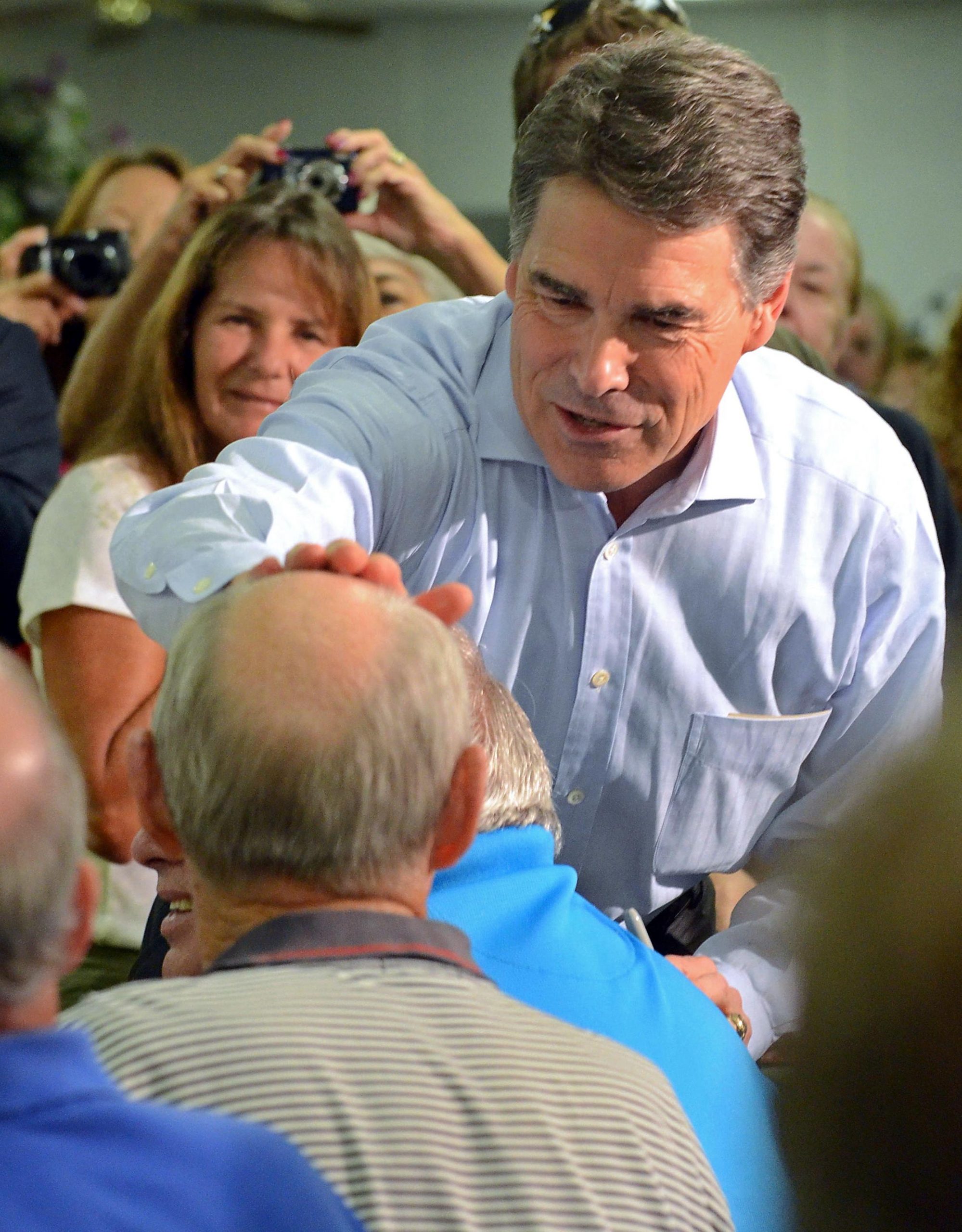 Perry says lift credit union lending caps