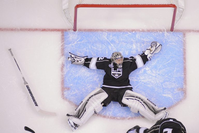   Los Angeles Kings goalie Jonathan Quick (32) falls backward as he defends against the New Jersey Devils in the third period during Game 4 of the NHL hockey Stanley Cup finals, Wednesday, June 6, 2012, in Los Angeles. The Devils won 3-1. (AP Photo/Mark J. Terrill)  