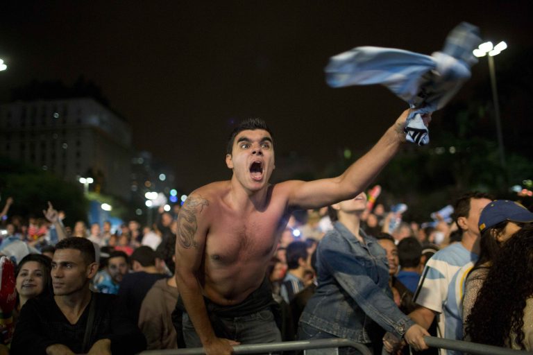 A fan of the Argentina national soccer team celebrates after his team defeated the Netherlands during a semifinals World Cup match, at the FIFA Fan Fest, in Sao Paulo, Brazil, Wednesday, July 9, 2014. Argentina made it to the World Cup final with a 4-2 shootout win over the Netherlands after the game finished in a 0-0 stalemate. (AP Photo/Rodrigo Abd)