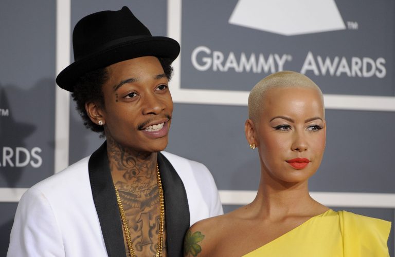  FILE - This Feb. 12, 2012 file photo shows Wiz Khalifa, left, and Amber Rose at the 54th annual Grammy Awards in Los Angeles. Khalifa says the preparation of becoming a first-time father and husband has helped put him in a more mature musical state of mind. 