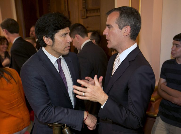 Los Angeles Mayor Eric Garcetti, right, talks with Sen. Kevin de Leon, D-Los Angles, during his first official visit to the Capitol in Sacramento, Calif., June 5, 2014.  Garcetti met with Legislative leaders and Gov. Jerry Brown to make his case for getting state aid to help revitalize California's most populous city. (AP Photo/Rich Pedroncelli)