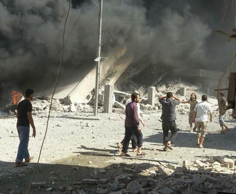 This image taken in Wednesday, Sept. 30, 2015 posted on the Twitter account of Syria Civil Defence, also known as the White Helmets, a volunteer search and rescue group, shows the aftermath of an airstrike in Talbiseh, Syria.Â (Syria Civil Defence via AP)