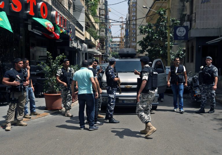 FILE - In this file photo taken Friday, June 20, 2014, Lebanese police intelligence gather outside a hotel in Hamra street in Beirut, Lebanon. An al-Qaida breakaway group's seizure of territory in Iraq and Syria has sent tremors across the Middle East, jolting neighboring countries into action over fears that the Islamic militants may set their sights on them next. In Lebanon heavily armed police busted a suspected sleeper cell allegedly linked to the group, known as the Islamic State of Iraq and the Levant, in raids on two hotels in central Beirut. (AP Photo/Bilal Hussein, File)