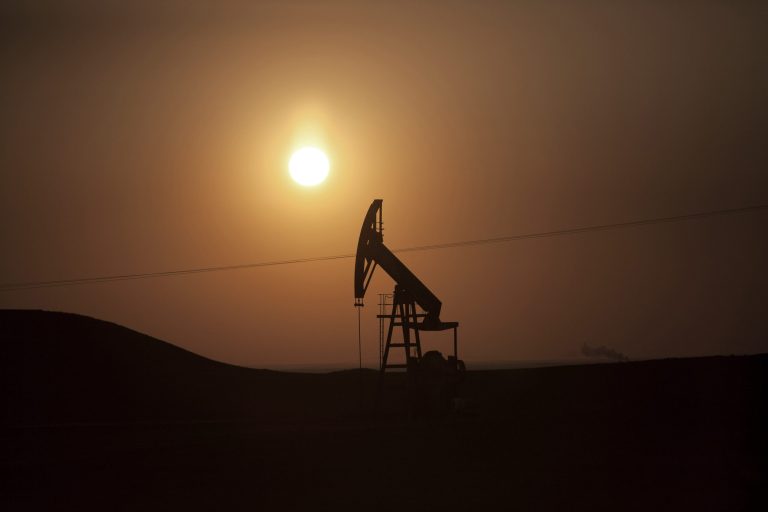 FILE - In this March 2, 2013 file photo, a view of an oil field under control of Kurdish militias near the town of Deriq, in a Kurdish area of Syria, near the border with Iraq. The Islamic State militants, who once relied on wealthy Persian Gulf nations for money, have become a self-sustaining financial juggernaut, earning more than $3 million a day from oil smuggling, human trafficking, theft and extortion, according to U.S. intelligence officials and private experts. The group, which has taken over large sections of Syria and Iraq, controls as many as 11 oil fields in both countries, analysts say. It is selling oil and other goods through generations-old smuggling networks under the noses of some of the same governments it is fighting: Kurdish-controlled northern Iraq, Turkey and Jordan. (AP Photo/Manu Brabo, File)