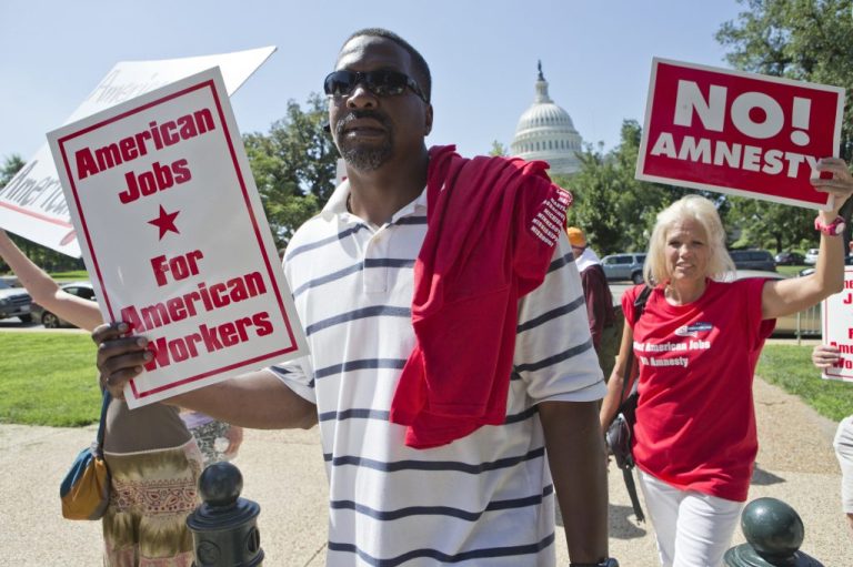 People opposed to immigration reform gather at a rally on Capitol Hill.