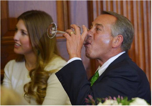 House Speaker John Boehner takes a drink while watching entertainers perform during a luncheon at the US Capitol on March 14, 2014 in Washington, DC. (MANDEL NGAN/AFP/Getty images)