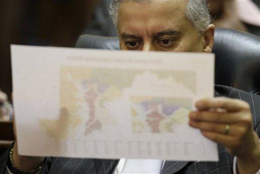 Maryland House of Delegate member Kumar Barve, D-Montgomery, looks over a proposed congressional redistricting map of Maryland during a special session in Annapolis, Md., Wednesday, Oct. 19, 2011. 
