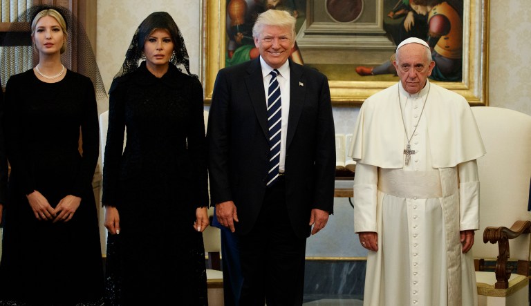 First lady Melania Trump and Ivanka Trump wore black veils and tea-length dresses to meet Pope Francis at the Vatican on Wednesday. (AP Photo/Evan Vucci)