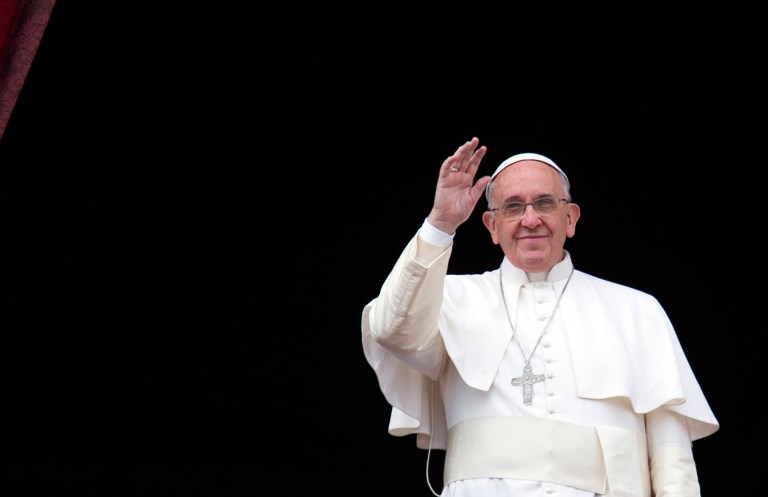 Pope Francis waves from the central balcony of St. Peter's Basilica at the Vatican, Thursday.(AP Photo/Alessandra Tarantino)