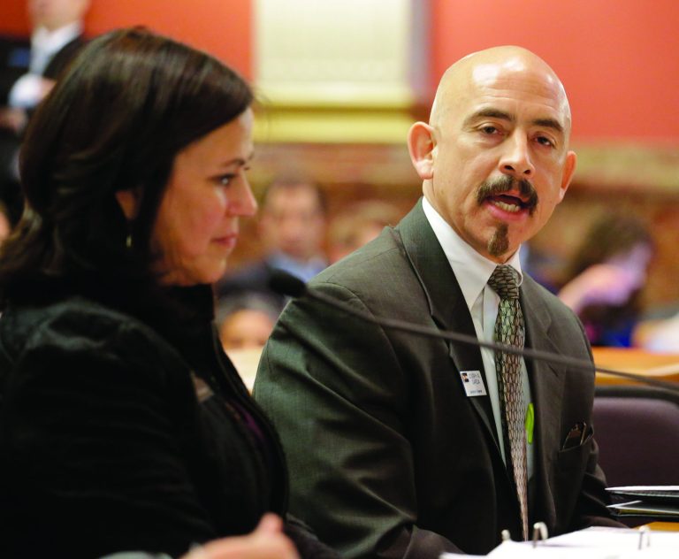 Lt. Gov. Joe Garcia testifies on a tuition bill before the Senate Education committee at the Capitol in Denver on Thursday, Jan. 24, 2013. One of the sponsors of the bill that would give illegal immigrants in Colorado in-state tuition rates Angela Giron, D-Pueblo listens at left. (AP Photo/Ed Andrieski)