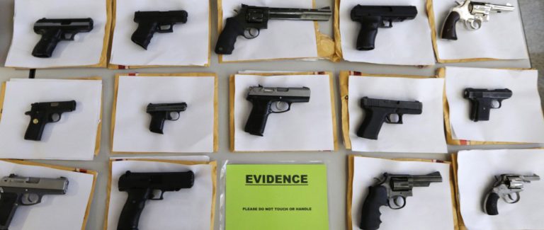 In this Monday, July 7, 2014, file photo, Chicago police display some of the thousands of illegal firearms they have confiscated so far this year in their battle against gun violence in Chicago. (AP Photo/M. Spencer Green, File))