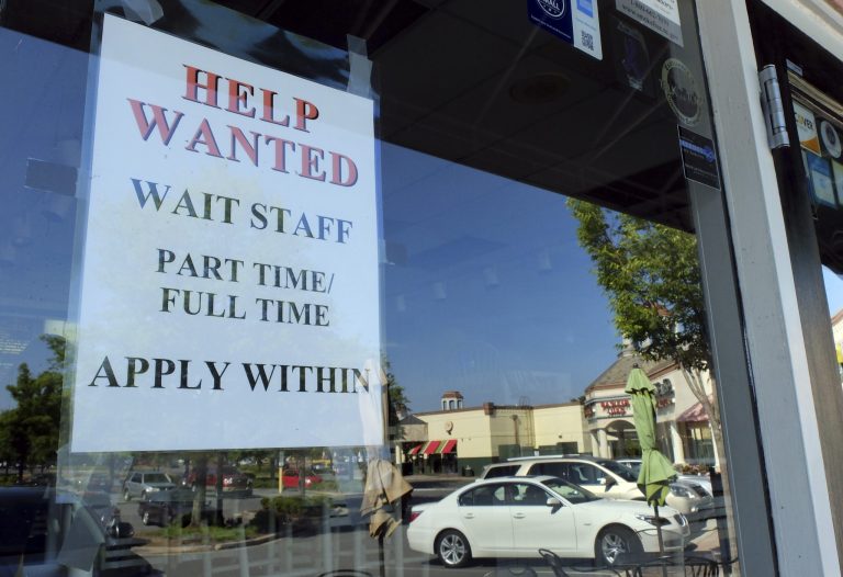 With more people receiving unemployment benefits, and given the costs associated with working, employers have to pay more to attract the unemployed.ÃÂ (AP Photo/Chuck Burton)
