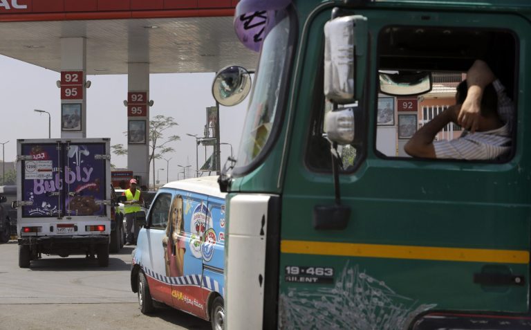 Egyptian drivers wait in line to buy fuel at a gasoline station in Cairo, Egypt, Saturday, July 5, 2014. Egypt's government raised the prices of fuel by up to 78 percent starting Saturday, following on a promise to cut subsidies that eat up nearly a quarter of the state budget, the official news agency reported. The country's successive leaders have balked at reducing subsidies because half of the country's 85 million people live at or below the poverty line of $2 a day and rely on government subsidies of wheat and fuel for survival. (AP Photo/Amr Nabil)