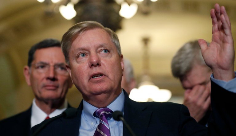 Sen. Lindsey Graham, R-S.C., center, speaks, accompanied by Sen. John Barrasso, R-Wyo., left, and Sen. Bill Cassidy, R-La., on Capitol Hill, Tuesday, Sept. 19, 2017 in Washington. (AP Photo/Alex Brandon)