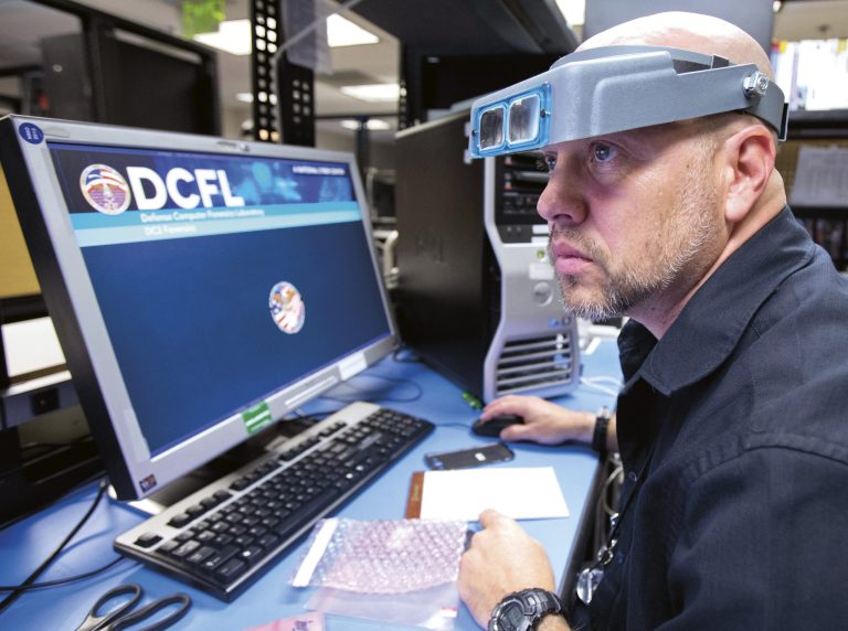 A specialist works at the Defense Computer Forensics Laboratory. (AP Photo/Manuel Balce Ceneta)
