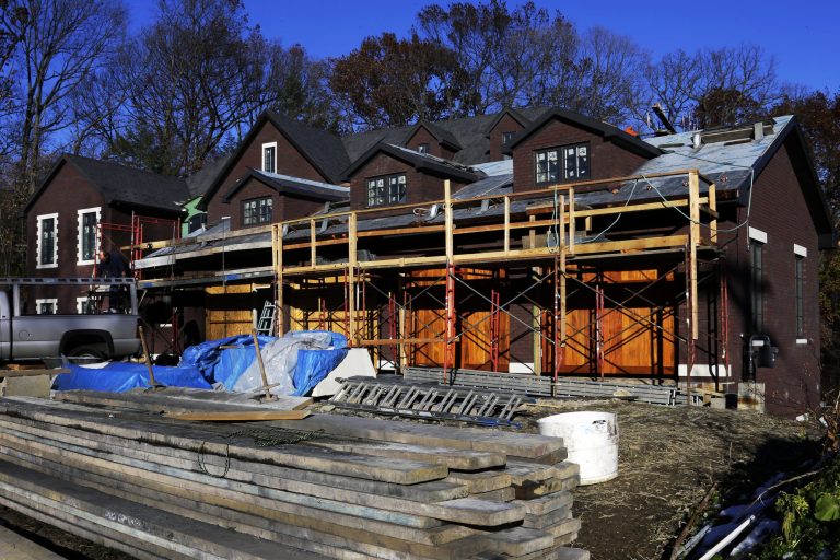 In this Thursday, Nov. 14, 2013 photo, construction continues on a new single family home in Mount Lebanon, Pa.  The Commerce Department reports the pace at which builders broke ground on homes in November on Wednesday, Dec. 18, 2013. (AP Photo/Gene J. Puskar)
