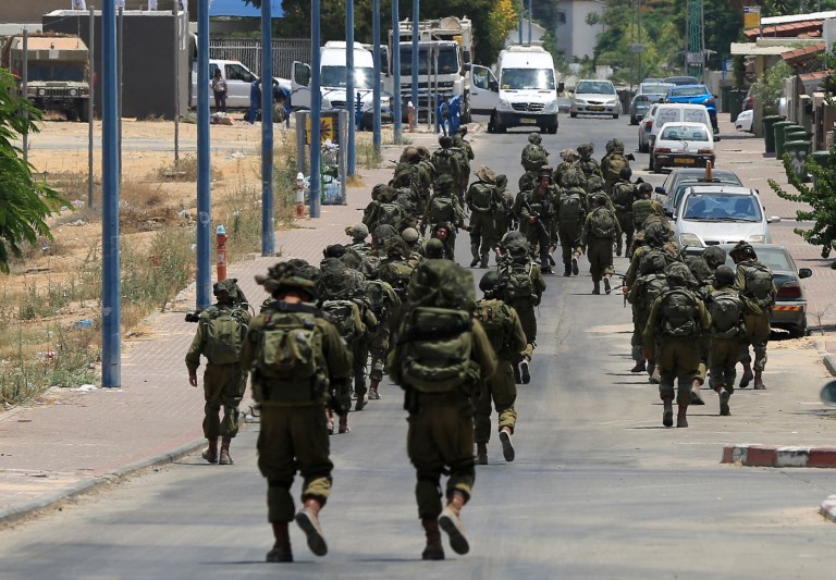 Israeli soldiers patrol the town of Sderot after a group of Hamas militants was detected infiltrating into Israel. (AP/Tsafrir Abayov, File)