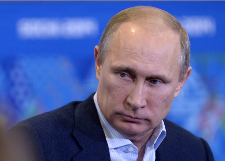 Russian President Vladimir Putin meets with Olympic volunteers in the Black Sea resort of Sochi, Russia, on Friday. (AP Photo/RIA-Novosti, Alexei Nikolsky, Presidential Press Service)
