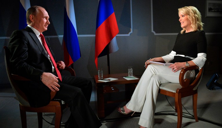 Russian President Vladimir Putin talks with Megyn Kelly during an interview with NBC's 