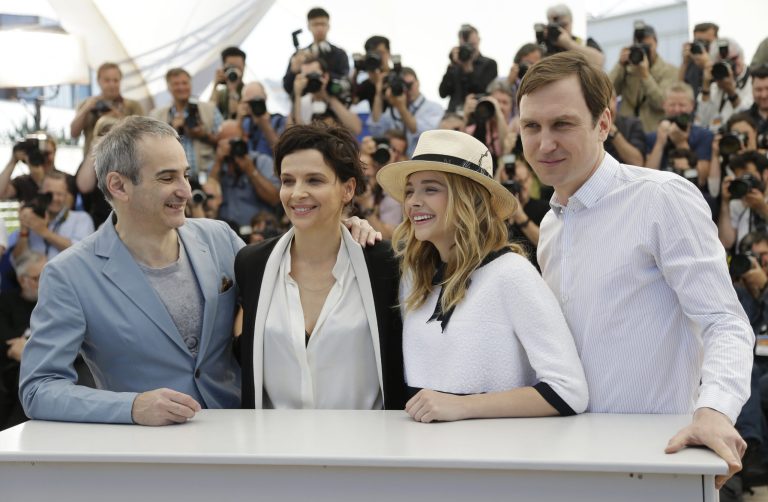 From left, director Olivier Assayas, actress Juliette Binoche, actress Chloe Grace Moretz, and actor Lars Eidinger pose for photographers during a photo call for Sils Maria at the 67th international film festival, Cannes, southern France, Friday, May 23, 2014. (AP Photo/Thibault Camus)