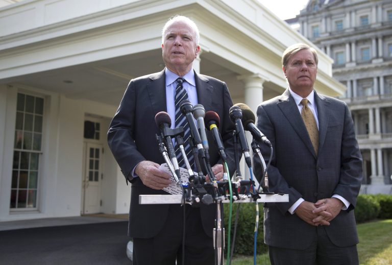   FILE - In this Sept. 2, 2013, file photo Sen. John McCain, R-Ariz., with Sen. Lindsey Graham, R-S.C., right, speaks with reporters outside the White House in Washington after a closed-door meeting about Syria with President Barack Obama. In a statement released Saturday, Sept. 14, 2013, McCain and Graham said a Syrian chemical weapons agreement is meaningless. They said friends and enemies of the U.S. will view the deal, reached between the U.S. and Russia Saturday, as 