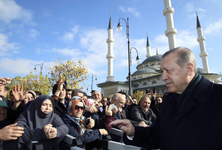 Turkey's President Recep Tayyip Erdogan speaks with people after Friday prayers at a mosque inside his presidential palace in Ankara, Turkey, Friday, Nov. 24. 2017. Erdogan's office says the Turkish leader has discussed the Syrian crisis and other regional issues with U.S. President Donald Trump. (Pool via AP)