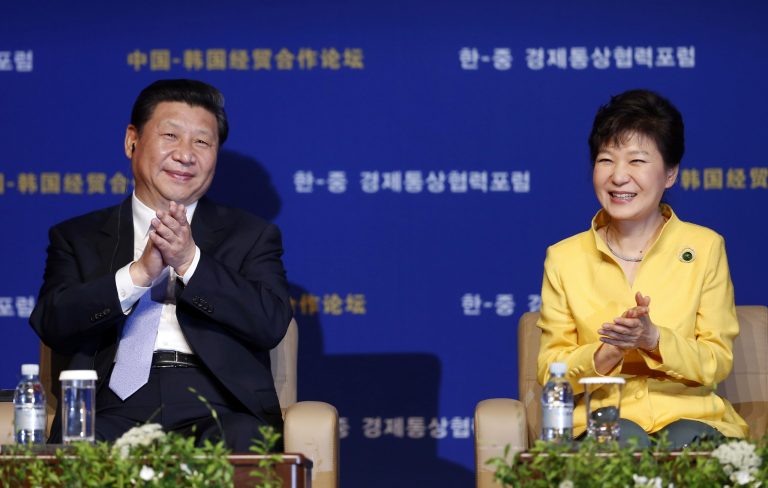 FILE - In this July 4, 2014 file photo, Chinese President Xi Jinping, left, and South Korean President Park Geun-hye attend the Korea China Investment Forum at a hotel in Seoul, South Korea. Moscow is cozying up to its old rival China. China is holding hands with Seoul. Tokyo is striking deals with Pyongyang. In the ever-shifting game of Asian alliances, where just about everybody has a dispute over something or can actually remember a shooting war with their neighbors, past grudges run deep. But expedience and pragmatism often run deeper. (AP Photo/Kim Hong-ji, Pool, File)