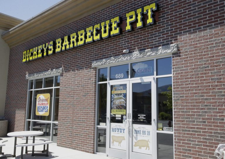 Dickey's Barbecue Pit is shown Monday, Aug. 18, 2014, in South Jordan, Utah. The Utah police agency investigating how iced tea that a woman drank at a restaurant ended up laced with an industrial cleaning solution is forwarding its findings to prosecutors to determine if anybody should be charged. Authorities have said an employee at Dickey's Barbecue in South Jordan unintentionally put the heavy-duty cleaner in a sugar bag, and a worker later mistakenly mixed it into the iced tea dispenser. (AP Photo/Rick Bowmer)