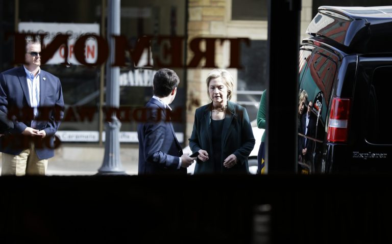 Democratic presidential candidate Hillary Rodham Clinton enters The Tremont cafe before speaking to local residents, Wednesday, April 15, 2015, in Marshalltown, Iowa. (AP Photo/Charlie Neibergall)