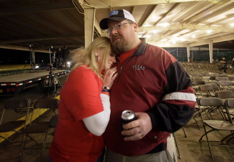 Brad Pustejovsky is hugged by his wife Dolores as he answers a reporters question about his brother Joey Pustejovsky, Thursday, in West, Texas. Joey was a volunteer firefighter in West, who was killed one year ago fighting a fire at a fertilizer plant that would later explode. AP Photo/Tony Gutierrez)