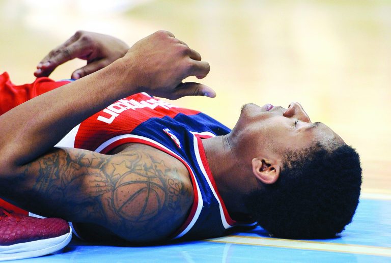 Chris Schneider/AP
Washington Wizards guard Bradley Beal injured his wrist falling to the floor against the Denver Nuggets on Jan. 18, in a game the Wizards won, 112-108.