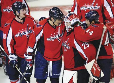 Nick Wass/AP
Capitals goalie Tomas Vokoun allowed three early goals and finished with 23 saves on 28 shots in his first action of the season.