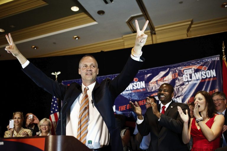 Curt Clawson celebrates along with a cheering crowd at his election party at the Hyatt Regency Coconut Point in Bonita Springs, Fla., after officially winning the special election in the Congressional District 19 Republican primary, on Tuesday, April 22, 2014. (AP Photo/Naples Daily News, Scott McIntyre)