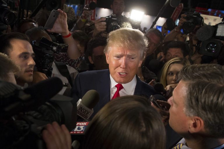 Republican presidential candidate Donald Trump speaks to the media in the spin room after the first Republican presidential debate at the Quicken Loans Arena Thursday, Aug. 6, 2015, in Cleveland. (AP Photo/John Minchillo)