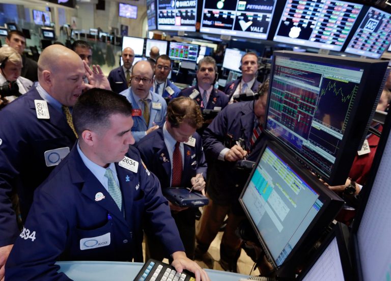 U.S. sees limited economic harm from past budget crises Specialists Michael O'Connor, left, and Matthew Diez, foreground left, work with traders at the post that handles US Steel, on the floor of the New York Stock Exchange Thursday, Oct. 17, 2013. Weak earnings from IBM and other major U.S. companies are dragging the stock market lower in early trading.  (AP Photo/Richard Drew)